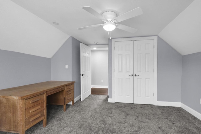 unfurnished office with carpet floors, ceiling fan, baseboards, and lofted ceiling