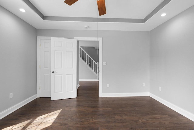 empty room with a ceiling fan, recessed lighting, and wood finished floors