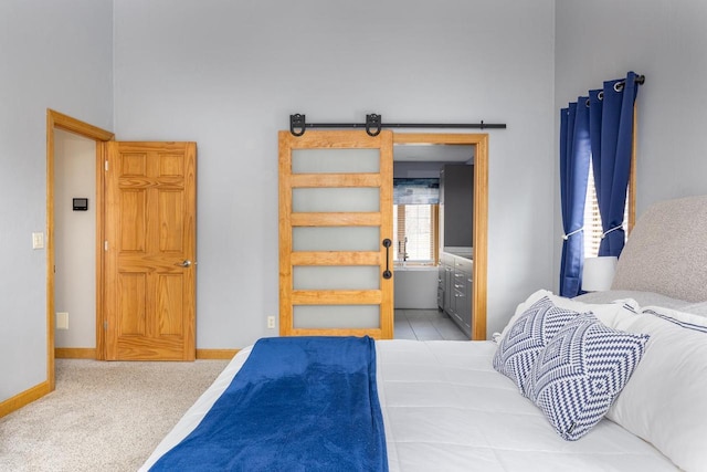 4175 Twilight Ct, Oshkosh, WI 54904 - bedroom with baseboards, a barn door, carpet, and ensuite bath
