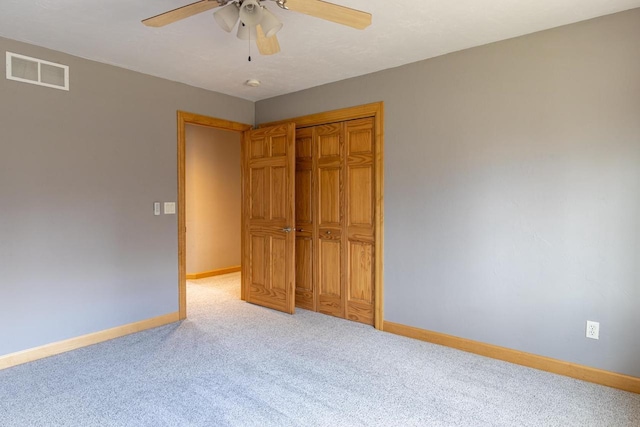 4175 Twilight Ct, Oshkosh, WI 54904 - unfurnished bedroom featuring baseboards, visible vents, light carpet, and a closet