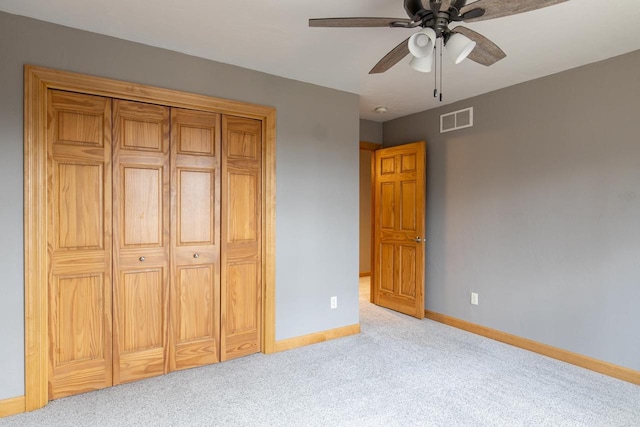 4175 Twilight Ct, Oshkosh, WI 54904 - unfurnished bedroom featuring light carpet, a ceiling fan, baseboards, visible vents, and a closet