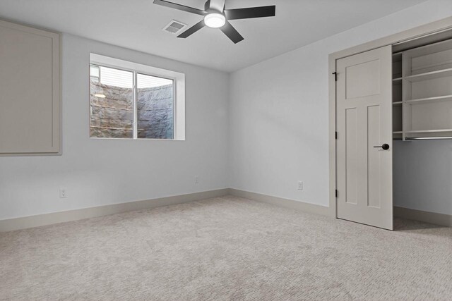 N9046 Southtowne Dr, Menasha, WI 54952 - unfurnished bedroom with carpet flooring, baseboards, visible vents, and a closet