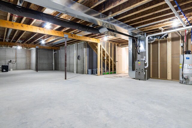 N9046 Southtowne Dr, Menasha, WI 54952 - unfinished basement featuring heating unit and water heater