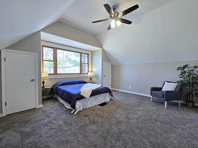 carpeted bedroom featuring baseboards, ceiling fan, and lofted ceiling
