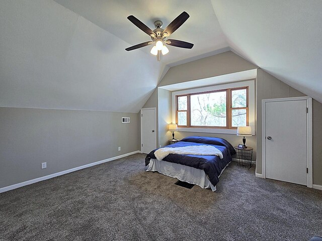 carpeted bedroom with a ceiling fan, baseboards, vaulted ceiling, and visible vents