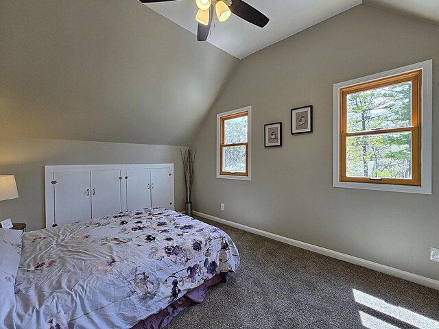 bedroom with baseboards, carpet, ceiling fan, and lofted ceiling