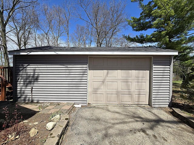 detached garage with aphalt driveway