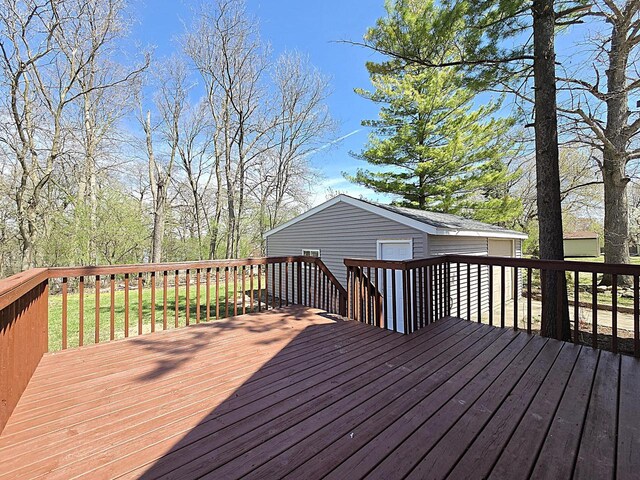 wooden deck with an outbuilding