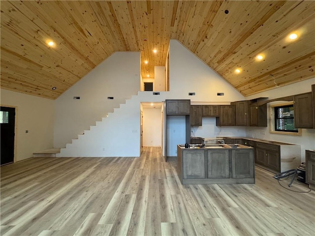 6069 Elsie Rd, Stone Lake, WI 54876 - kitchen with high vaulted ceiling, wood ceiling, light wood finished floors, a center island, and open floor plan