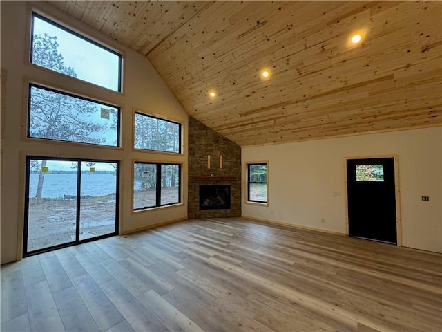 6069 Elsie Rd, Stone Lake, WI 54876 - unfurnished living room with high vaulted ceiling, wood ceiling, healthy amount of natural light, light wood-type flooring, and recessed lighting