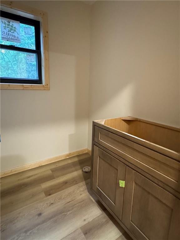 6069 Elsie Rd, Stone Lake, WI 54876 - bathroom featuring wood finished floors and baseboards