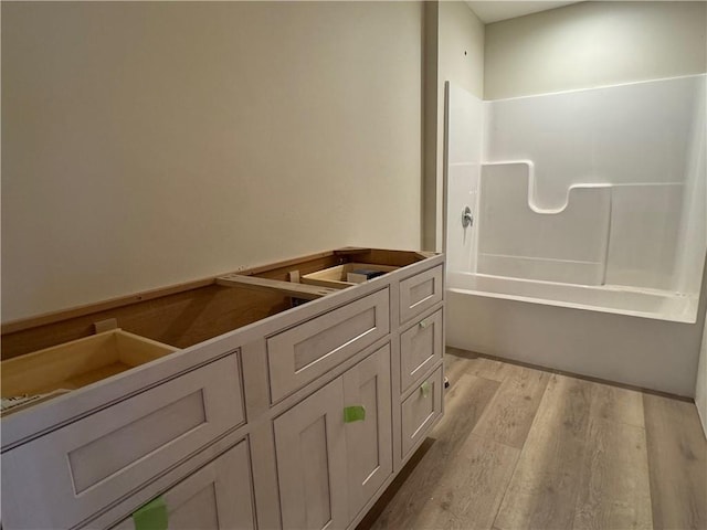 6069 Elsie Rd, Stone Lake, WI 54876 - full bathroom featuring wood finished floors and bathing tub / shower combination
