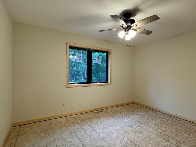 6069 Elsie Rd, Stone Lake, WI 54876 - spare room featuring baseboards and a ceiling fan