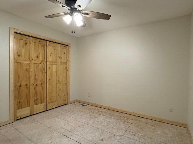 6069 Elsie Rd, Stone Lake, WI 54876 - unfurnished bedroom with baseboards and a ceiling fan