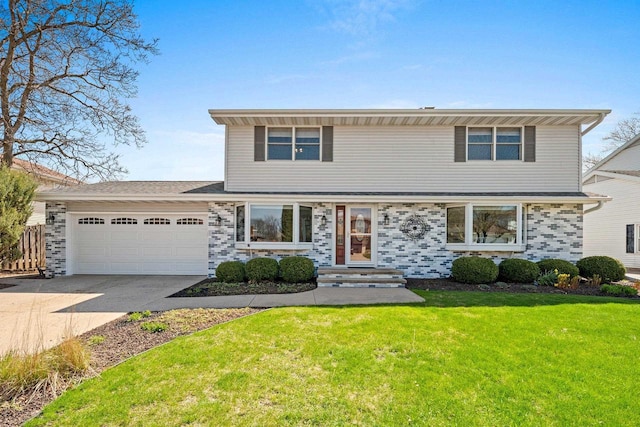 colonial-style house with a garage, entry steps, driveway, and a front lawn