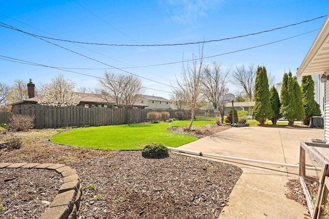 view of yard with a fenced backyard and a patio area