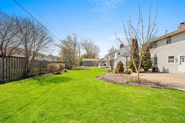 view of yard with fence and a residential view