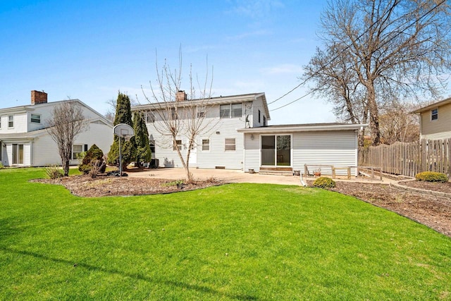 back of house with a chimney, a lawn, fence, a patio, and entry steps