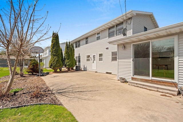 back of house featuring a patio and entry steps