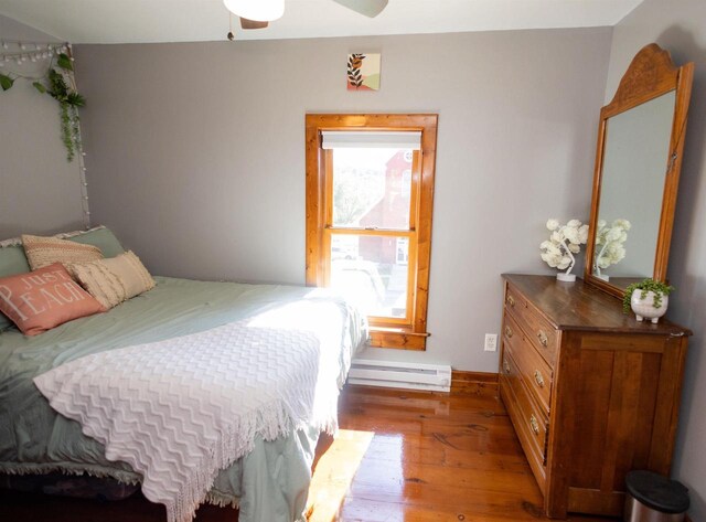 1694 Washington St, Verona, WI 53593 - bedroom with hardwood / wood-style flooring, baseboard heating, and baseboards