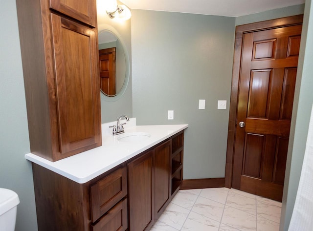 1694 Washington St, Verona, WI 53593 - bathroom with marble finish flooring, vanity, and toilet