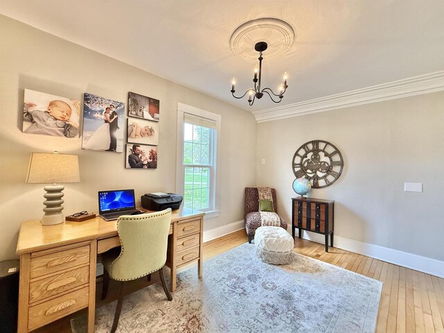 852 Sherwood Dr NW, Beloit, WI 53511 - office area with baseboards, a chandelier, ornamental molding, and light wood-style flooring
