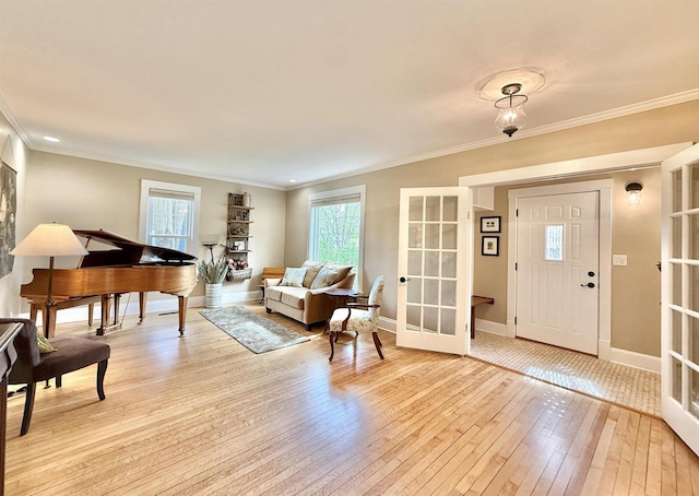 852 Sherwood Dr NW, Beloit, WI 53511 - living area with baseboards, ornamental molding, french doors, and light wood-style flooring