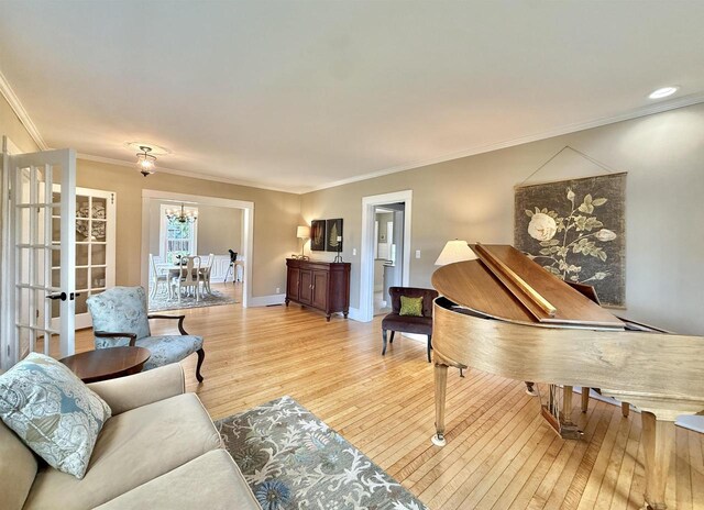 852 Sherwood Dr NW, Beloit, WI 53511 - living room with baseboards, ornamental molding, and light wood finished floors