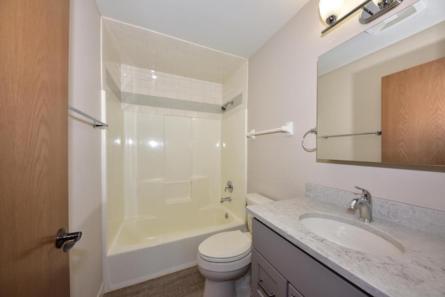 bathroom with vanity, shower / bathtub combination, and toilet