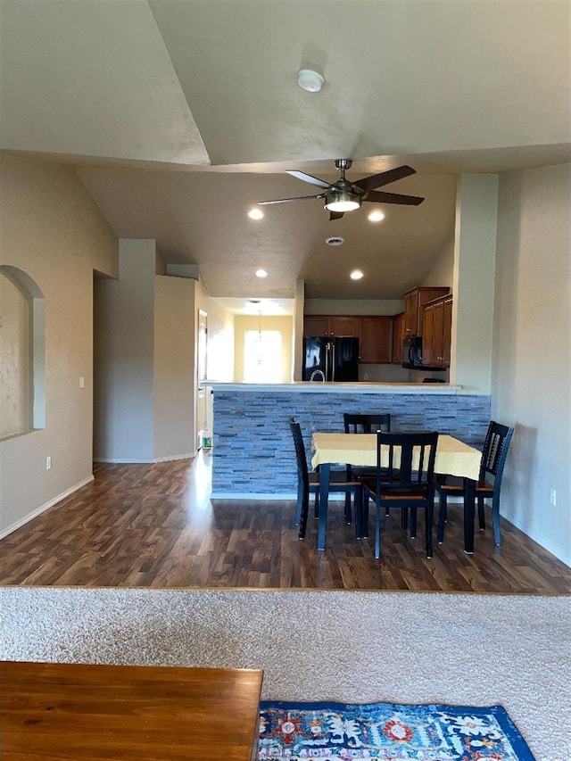 dining room featuring baseboards, recessed lighting, ceiling fan, and wood finished floors