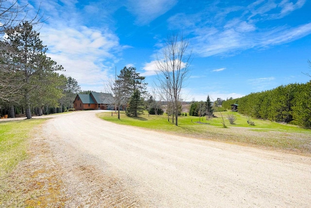 view of road with dirt driveway