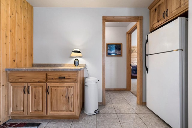 bathroom featuring tile patterned floors and baseboards