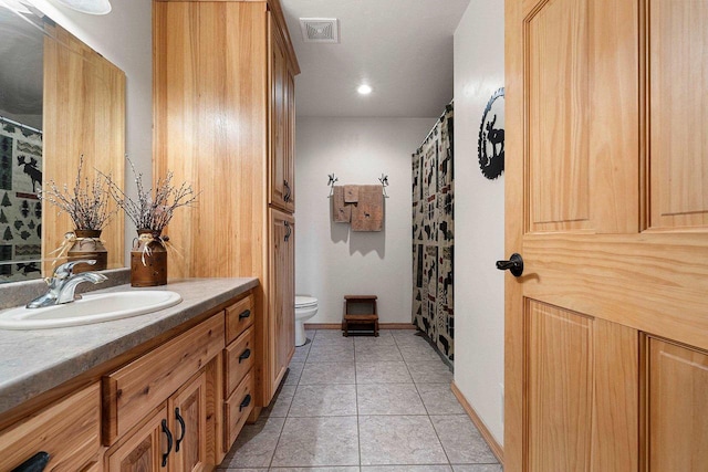 full bathroom with visible vents, tile patterned flooring, vanity, toilet, and baseboards