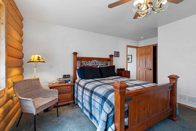 carpeted bedroom featuring a ceiling fan, rustic walls, and visible vents