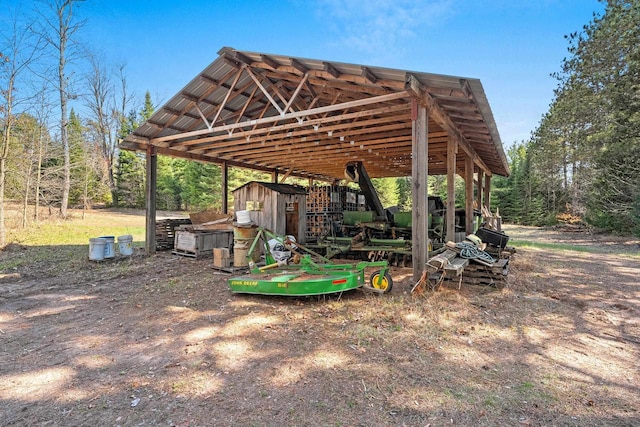 exterior space featuring an outbuilding and a shed