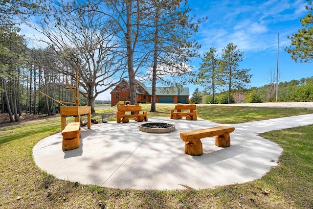 view of patio / terrace with a fire pit