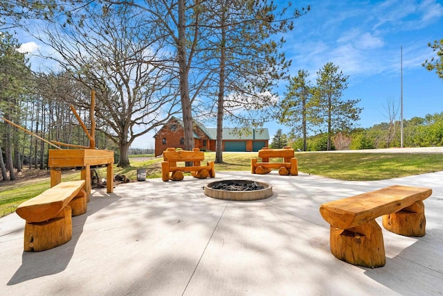 view of patio with a fire pit