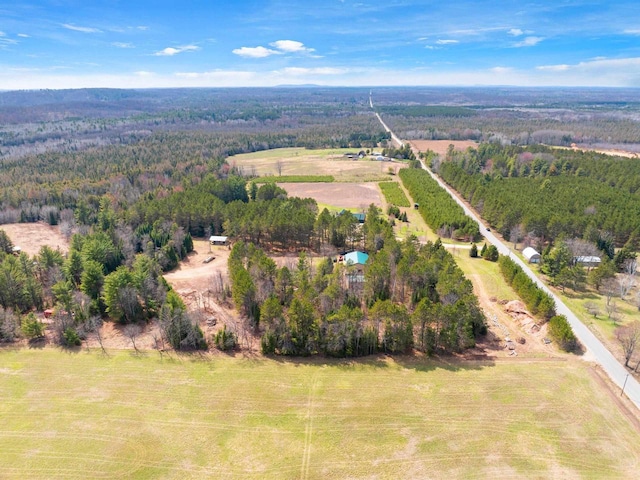 birds eye view of property with a rural view and a forest view