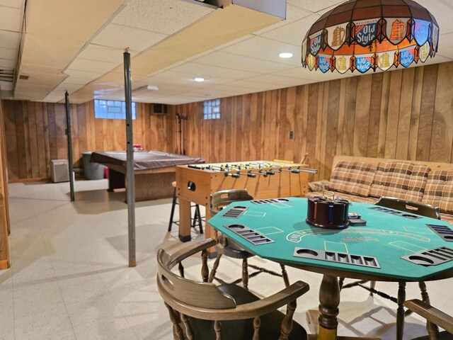 playroom with recessed lighting, wood walls, a paneled ceiling, and tile patterned floors