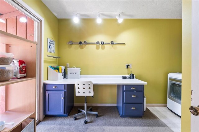 1206 Pinecrest Ln, New Richmond, WI 54017 - office area with baseboards, washer / dryer, track lighting, and light colored carpet