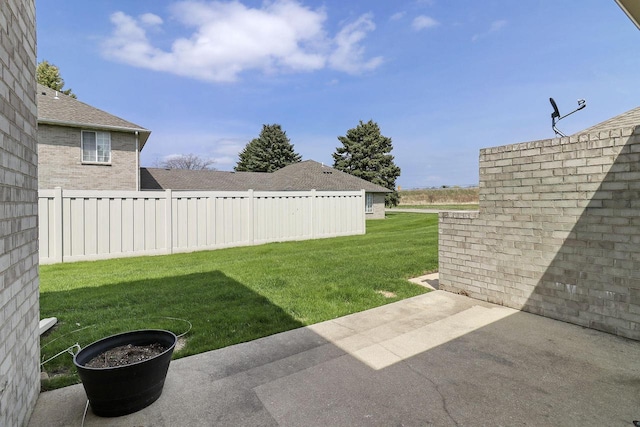view of yard with a patio and fence
