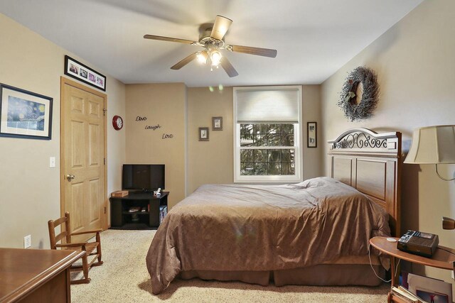 bedroom featuring ceiling fan and carpet flooring