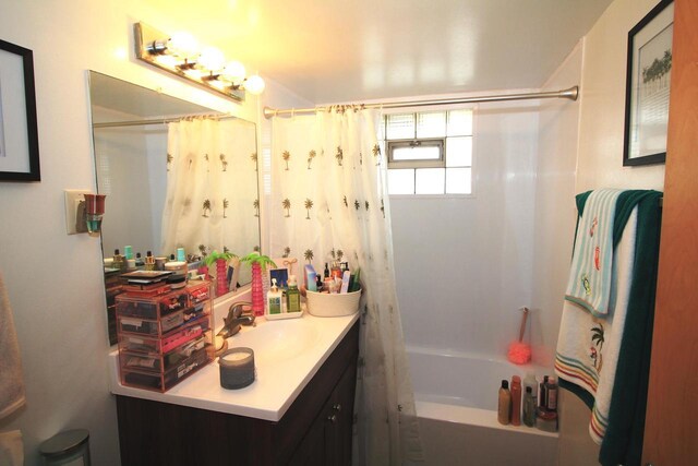 bathroom with shower / bath combo with shower curtain and vanity