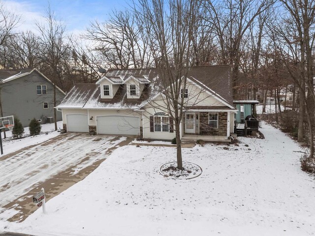 view of front of property with covered porch and stone siding