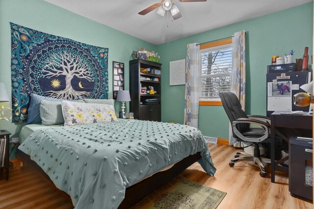 bedroom featuring ceiling fan and wood finished floors