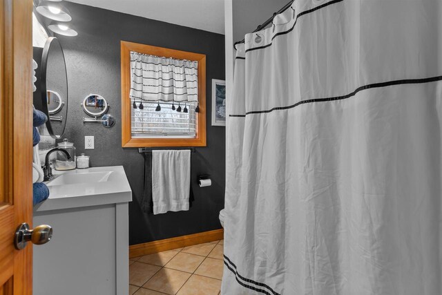 full bath featuring tile patterned floors, a shower with shower curtain, and vanity
