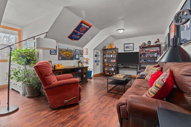 living room with a textured ceiling and wood finished floors
