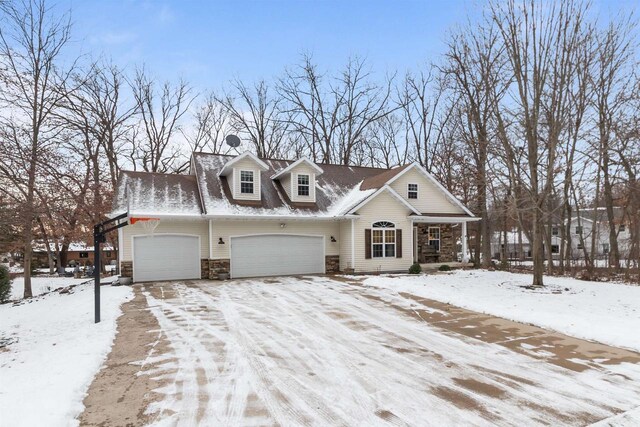 view of front facade featuring stone siding and a garage