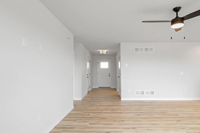 N6285 Blarney Stone Dr, Albany, WI 53520 - entryway featuring baseboards, ceiling fan, light wood finished floors, and visible vents