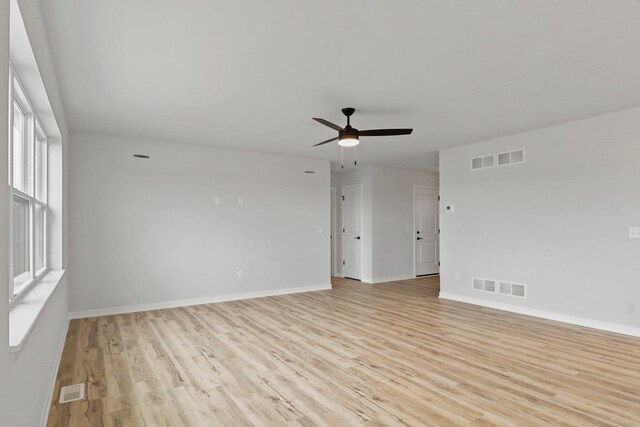 N6285 Blarney Stone Dr, Albany, WI 53520 - empty room with visible vents and light wood-type flooring